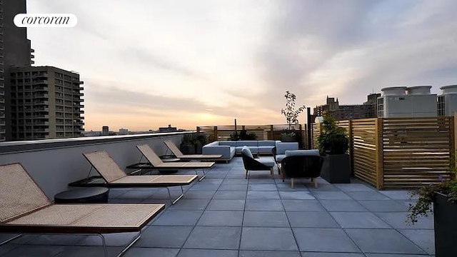 patio terrace at dusk with outdoor lounge area