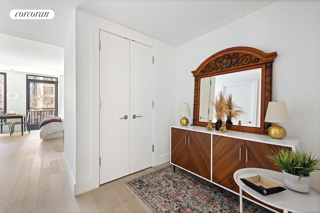 foyer entrance with light hardwood / wood-style floors