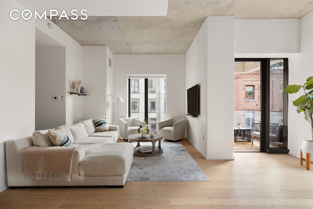 98 Front St Unit 8T, New York City, NY 11201 - living area featuring light wood finished floors and baseboards
