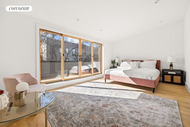bedroom featuring light wood-style flooring and visible vents