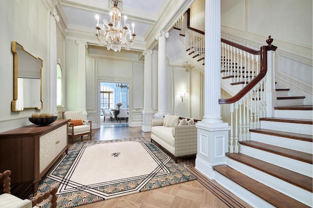 interior space featuring an inviting chandelier, parquet flooring, beamed ceiling, ornamental molding, and decorative columns