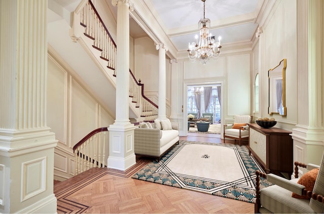 16 E 76th St, New York City, NY 10021 - sitting room with a decorative wall, a chandelier, stairs, ornate columns, and a towering ceiling