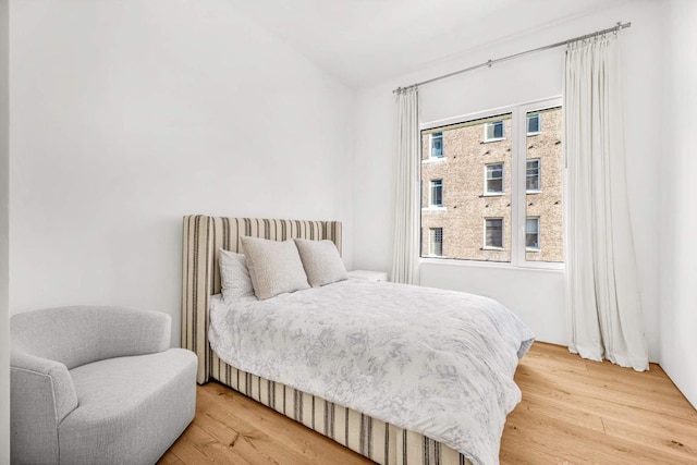 bedroom featuring wood finished floors