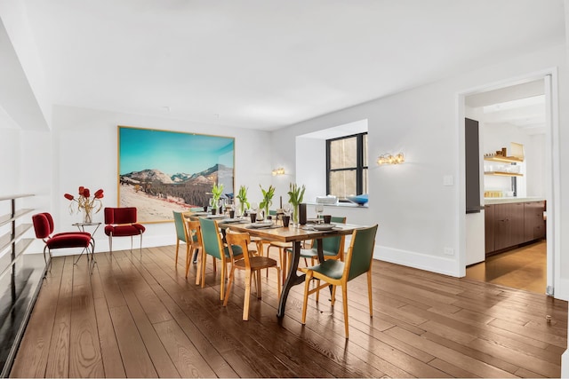 322 E 57th St Unit 12A, New York City, NY 10022 - dining area featuring wood-type flooring and baseboards
