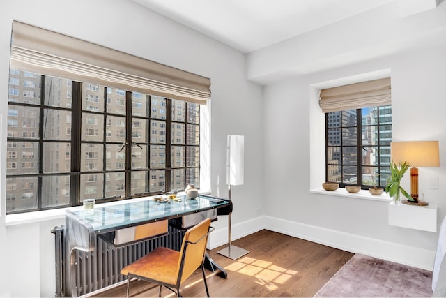 322 E 57th St Unit 12A, New York City, NY 10022 - office featuring baseboards and wood finished floors