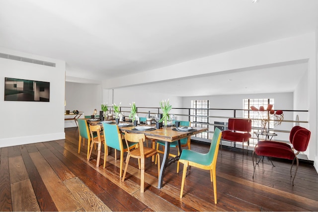 322 E 57th St Unit 12A, New York City, NY 10022 - dining area with baseboards, hardwood / wood-style floors, and visible vents