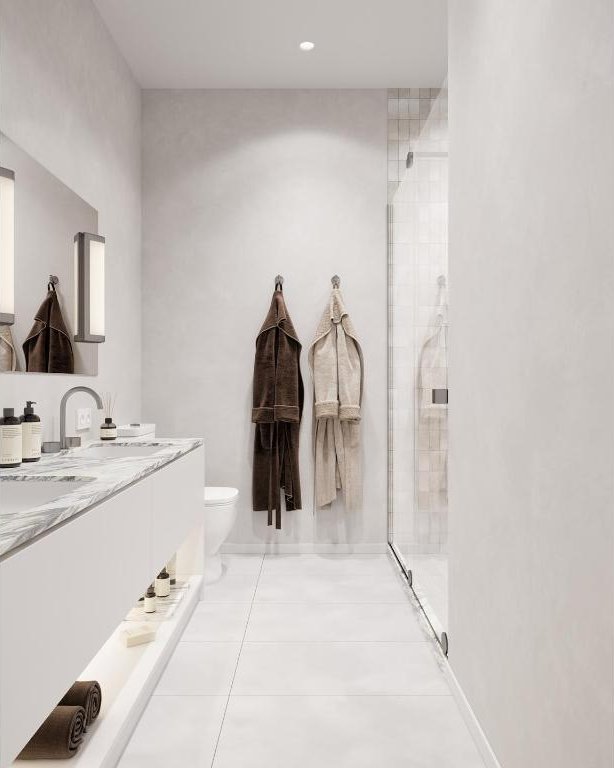 bathroom featuring tile patterned flooring, vanity, toilet, and a shower with shower door