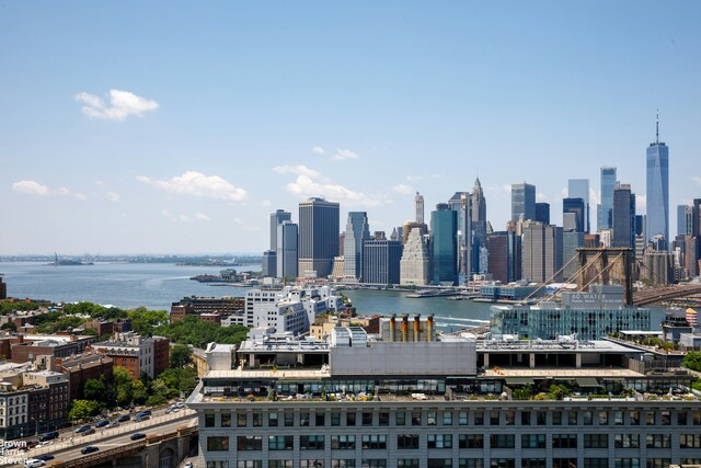 property's view of city featuring a water view