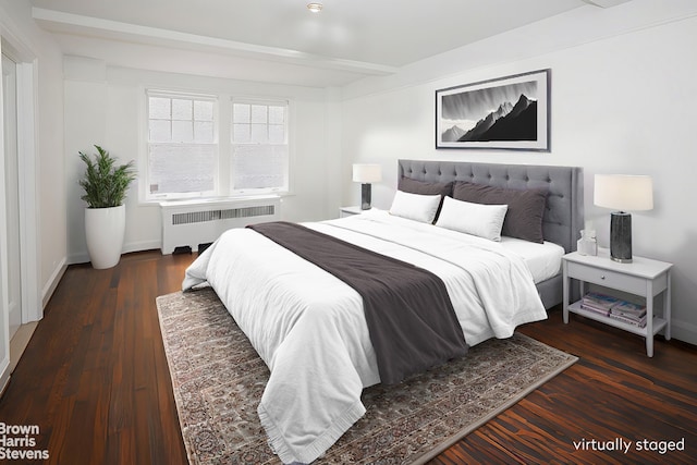 bedroom with radiator, beam ceiling, and dark wood-type flooring