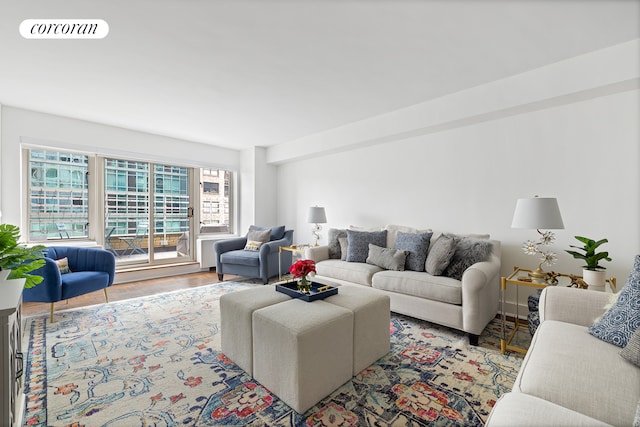 living room featuring visible vents and wood finished floors