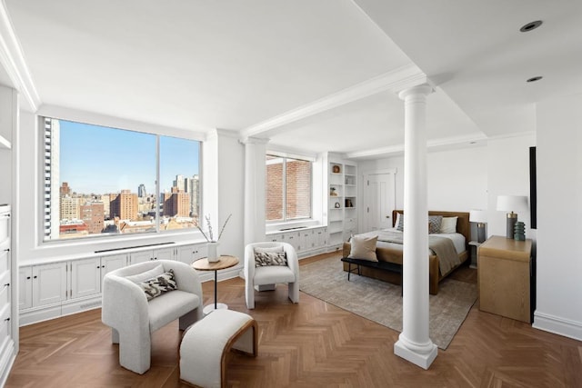 bedroom with ornamental molding, parquet flooring, and ornate columns