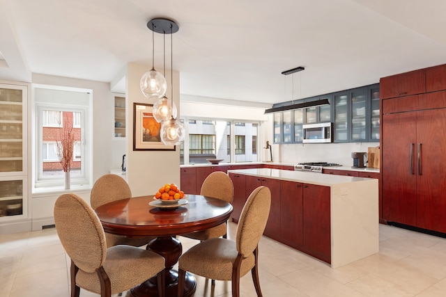 35 E 85th St Unit 2Fg, New York City, NY 10028 - dining space with healthy amount of natural light and light tile patterned floors
