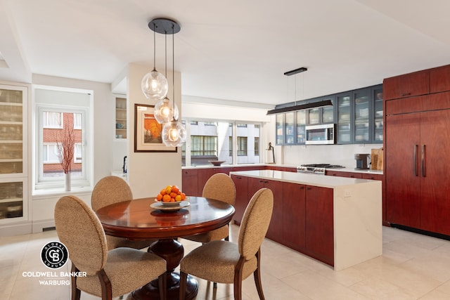 tiled dining room with plenty of natural light