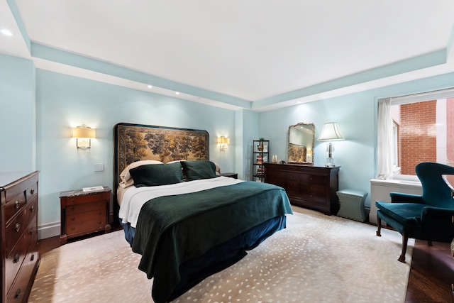 35 E 85th St Unit 2Fg, New York City, NY 10028 - bedroom featuring light wood-style floors and a raised ceiling