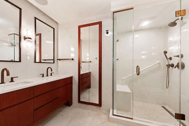 35 E 85th St Unit 2Fg, New York City, NY 10028 - full bath featuring a shower stall, double vanity, and tile patterned floors