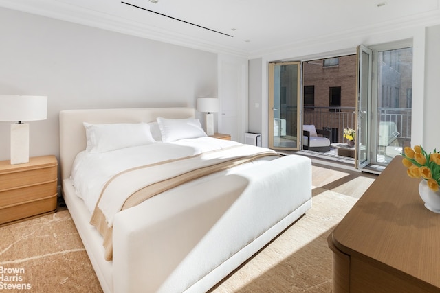 bedroom featuring crown molding and access to outside