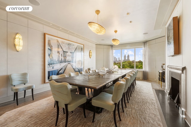 dining space featuring baseboards, visible vents, and a fireplace