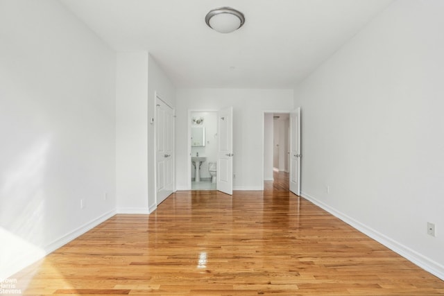 unfurnished room with light hardwood / wood-style flooring