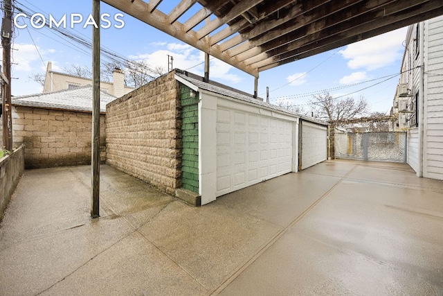 garage with fence