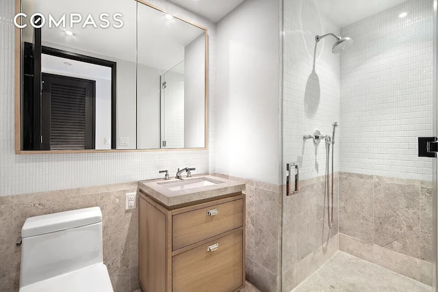 51 Jay St Unit 5D, New York City, NY 11201 - full bathroom featuring tile walls, a stall shower, vanity, and toilet