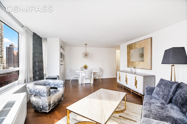 living room featuring baseboards and wood finished floors