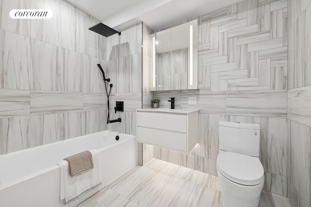 428 E 9th St Unit 703, New York City, NY 11218 - bathroom featuring vanity, toilet, tile walls, and shower / washtub combination