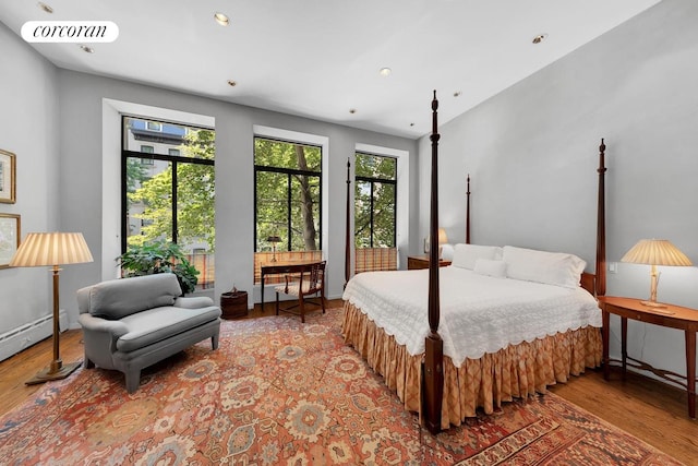 bedroom with wood finished floors, baseboards, visible vents, and recessed lighting