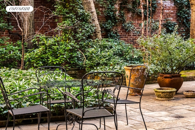 balcony with a patio area and outdoor dining area