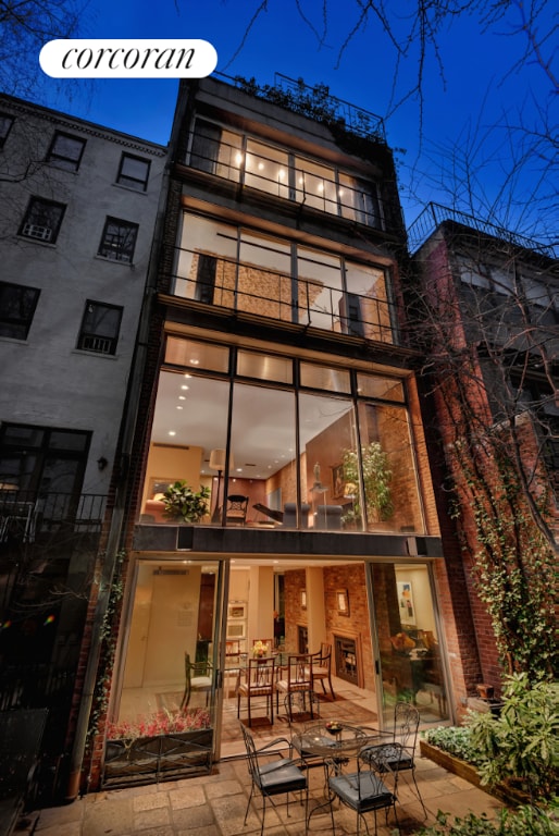 rear view of house with a patio