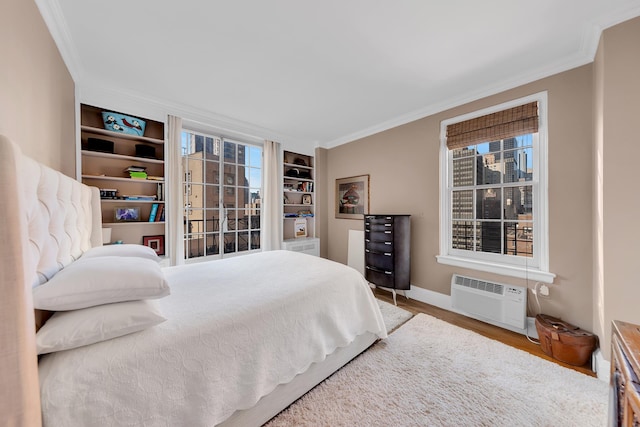 14 Sutton Pl S Unit 13F, New York City, NY 10022 - bedroom featuring a wall mounted air conditioner, crown molding, wood finished floors, and baseboards