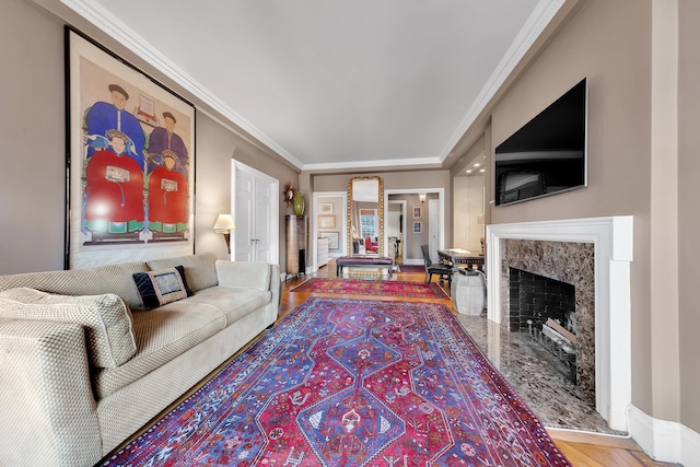 14 Sutton Pl S Unit 13F, New York City, NY 10022 - living room featuring a premium fireplace, wood finished floors, ornamental molding, and baseboards