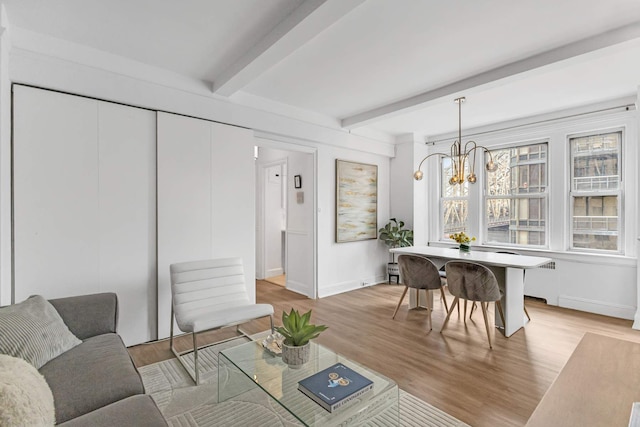 400 E 59th St Unit 9G, New York City, NY 10022 - living area featuring baseboards, a chandelier, light wood finished floors, and beam ceiling