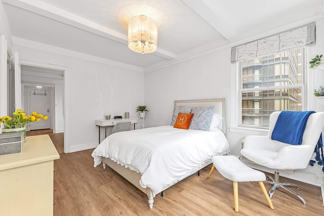 400 E 59th St Unit 9G, New York City, NY 10022 - bedroom with beam ceiling and wood finished floors
