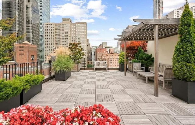 view of patio with a city view and a pergola