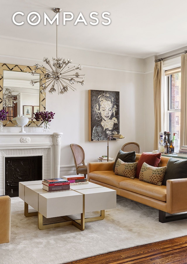 carpeted living room featuring a chandelier and a fireplace