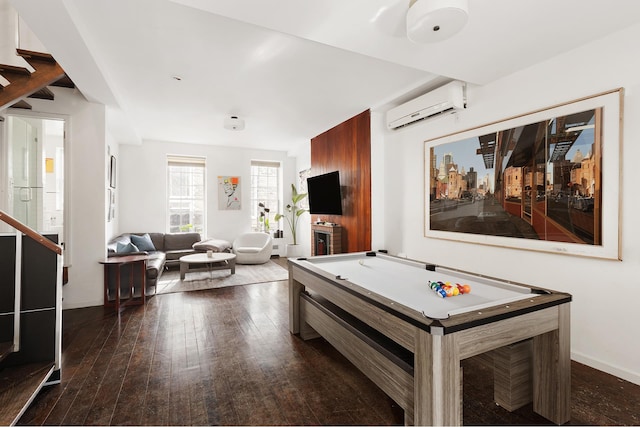 recreation room featuring billiards, baseboards, dark wood-style flooring, and a wall mounted AC