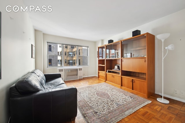 311 E 71st St Unit 8G, New York City, NY 10021 - living room featuring baseboards