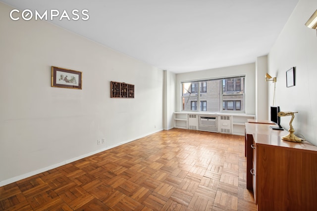 311 E 71st St Unit 8G, New York City, NY 10021 - unfurnished living room with baseboards and radiator heating unit