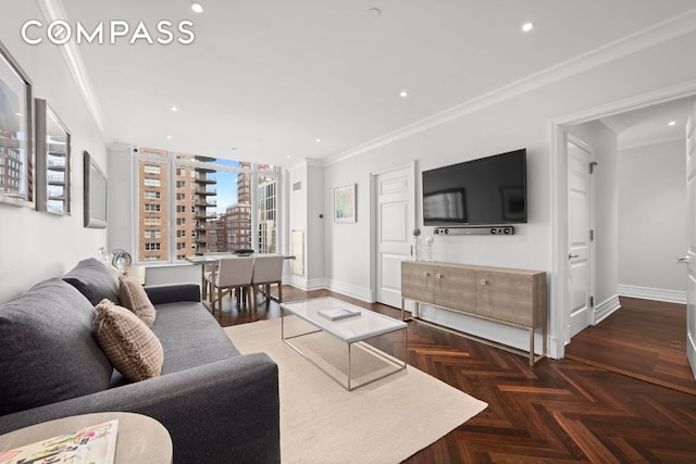 living room featuring baseboards, crown molding, and recessed lighting