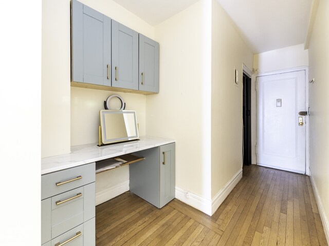 325 W 45th St Unit 404, New York City, NY 10036 - unfurnished office featuring baseboards and light wood finished floors