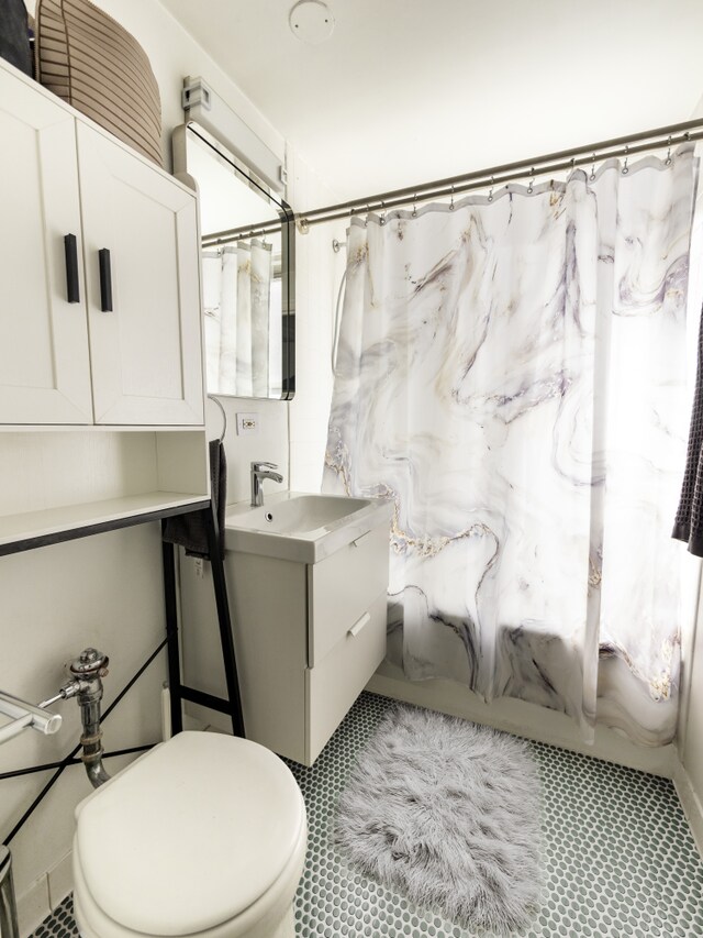 325 W 45th St Unit 404, New York City, NY 10036 - bathroom featuring toilet and vanity