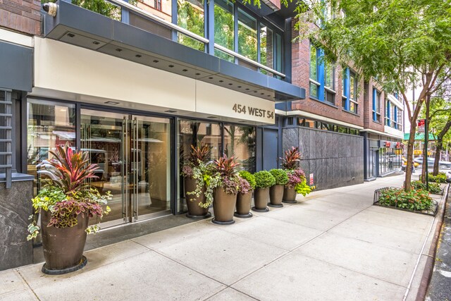 454 W 54th St Unit 3M, New York City, NY 10019 - entrance to property featuring brick siding
