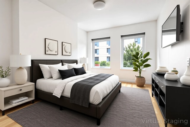 bedroom with light wood-type flooring