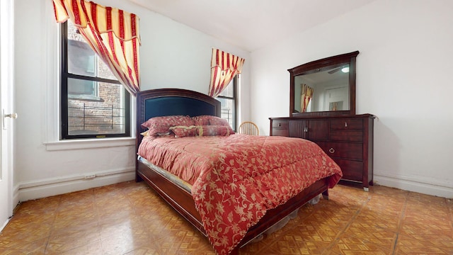 bedroom featuring baseboards