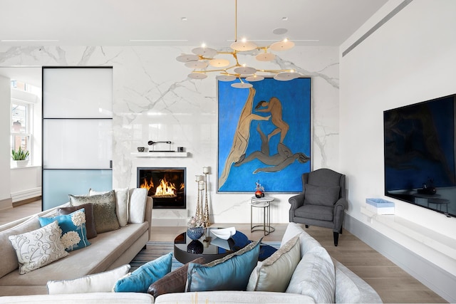 215 Sullivan St Unit 4A, New York City, NY 10012 - living room featuring wood finished floors and a high end fireplace