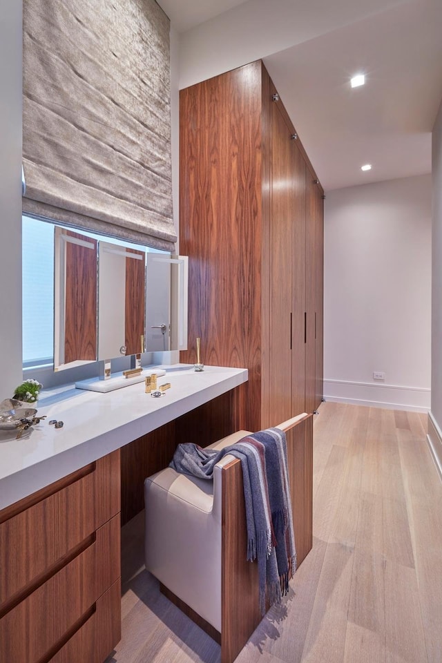 215 Sullivan St Unit 4A, New York City, NY 10012 - bathroom featuring vanity, wood finished floors, recessed lighting, and baseboards