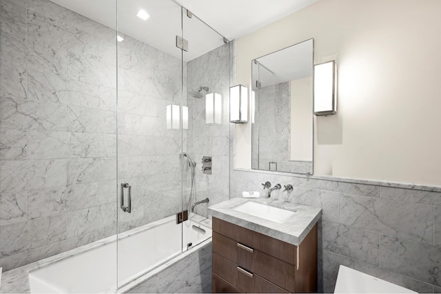 215 Sullivan St Unit 4A, New York City, NY 10012 - full bathroom featuring tile walls, enclosed tub / shower combo, and vanity