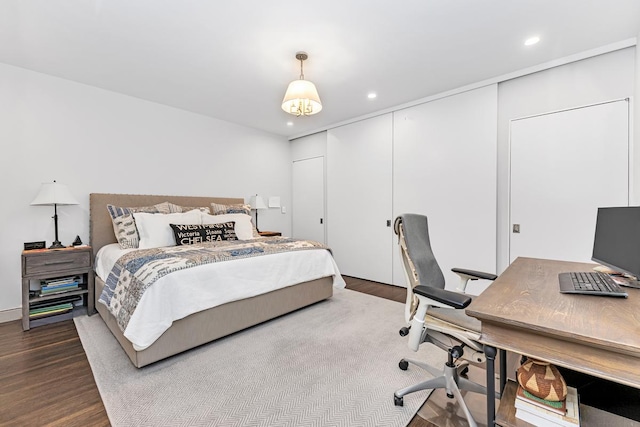 24 W 69th St Unit 9B, New York City, NY 10023 - bedroom featuring dark wood-type flooring and recessed lighting