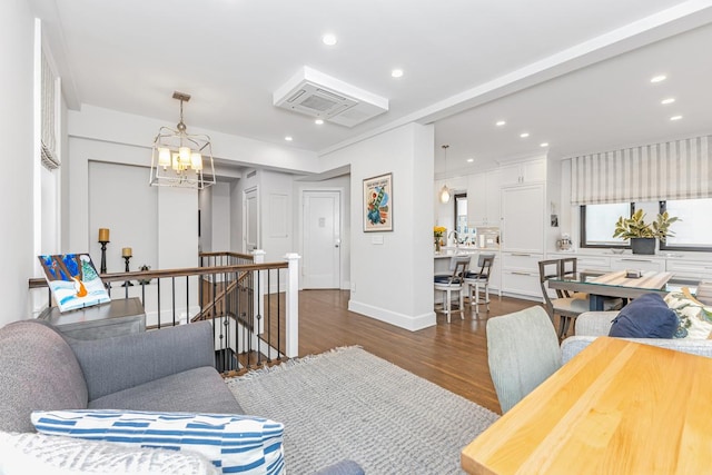 24 W 69th St Unit 9B, New York City, NY 10023 - living room featuring baseboards, a chandelier, dark wood-type flooring, and recessed lighting