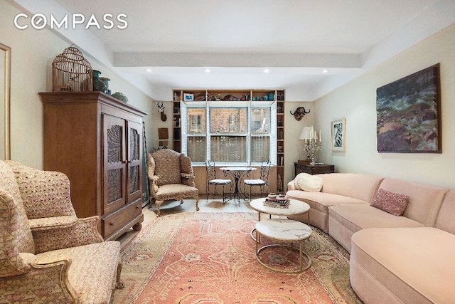 living room featuring beamed ceiling